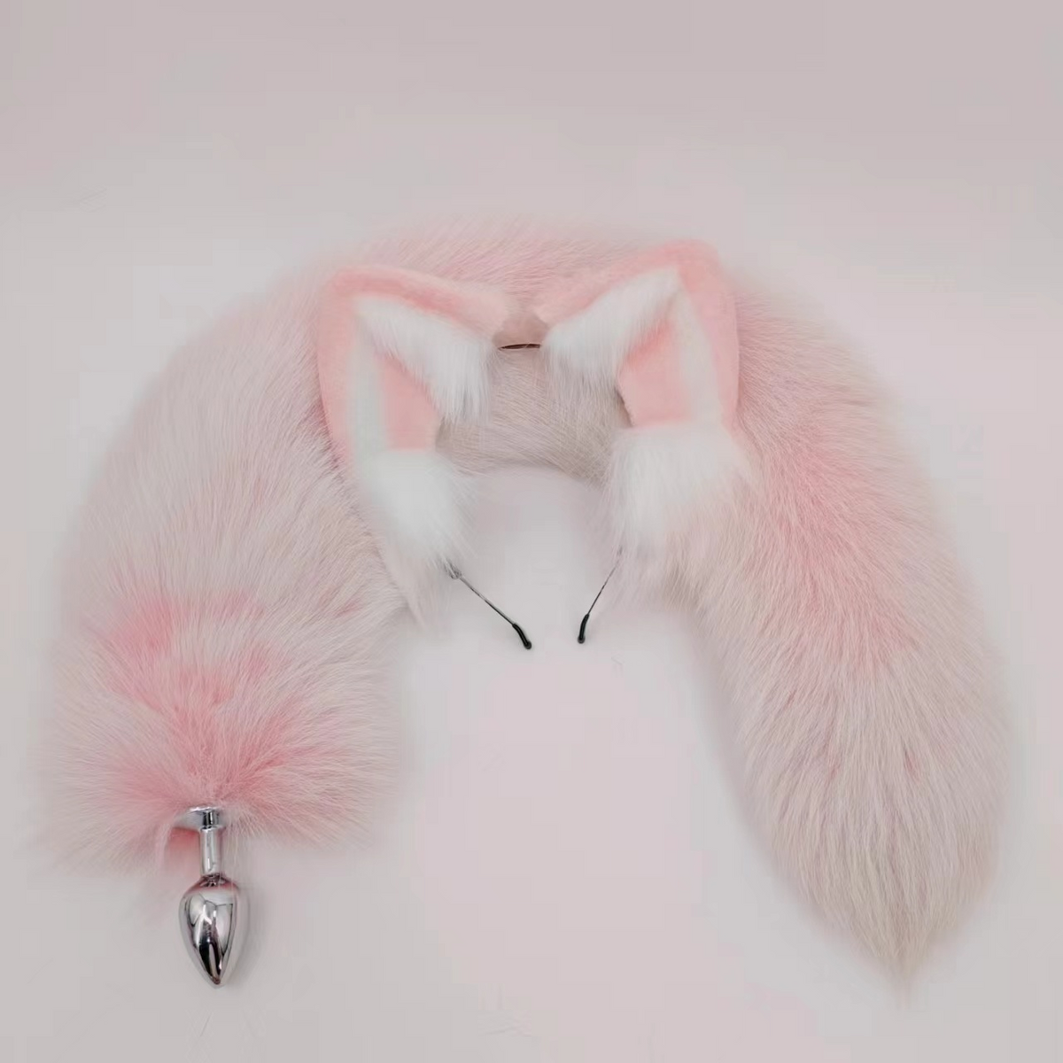Pink arctic fox tail butt plug