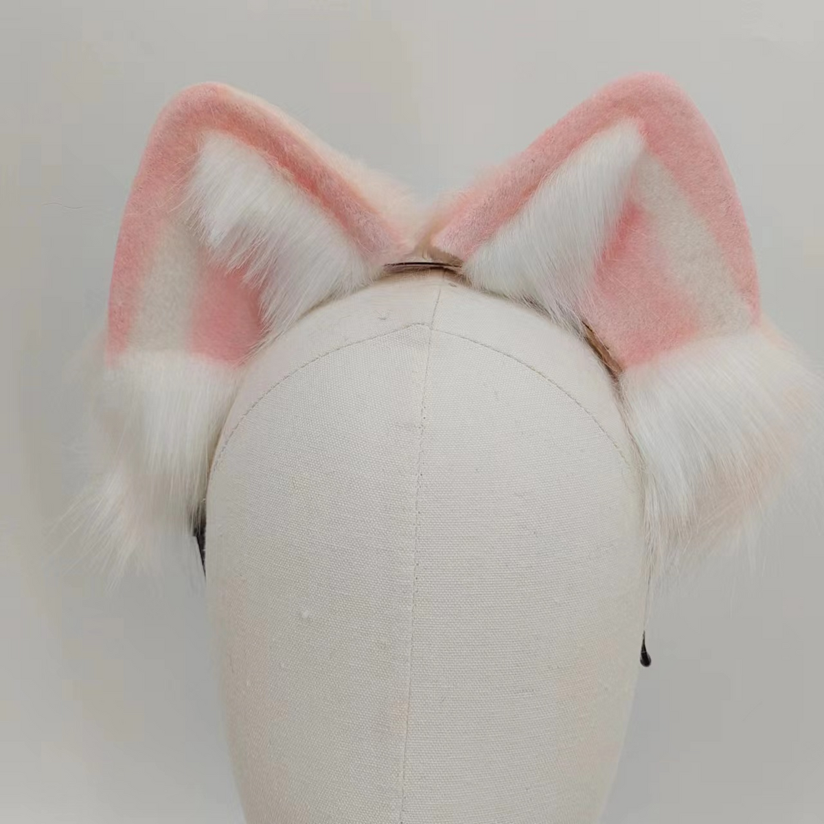 Pink arctic fox tail butt plug