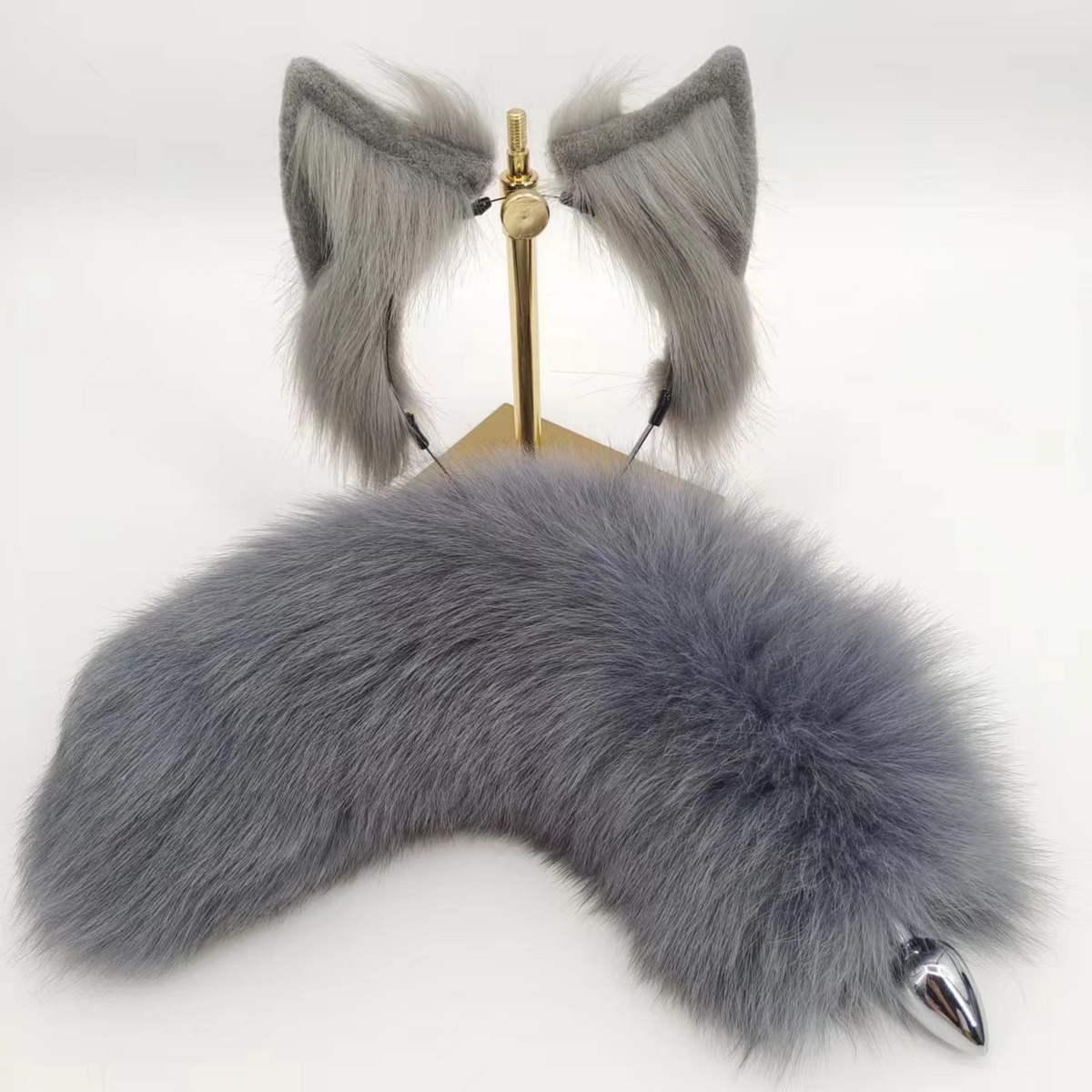 Grey furry fox tail metal butt plug
