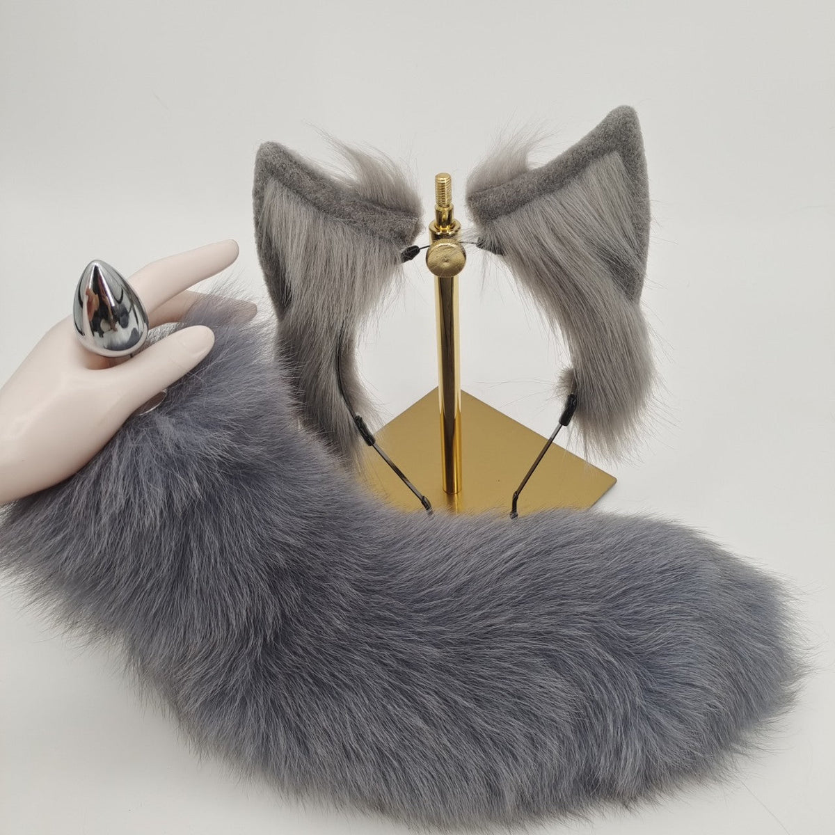 Grey furry fox tail metal butt plug