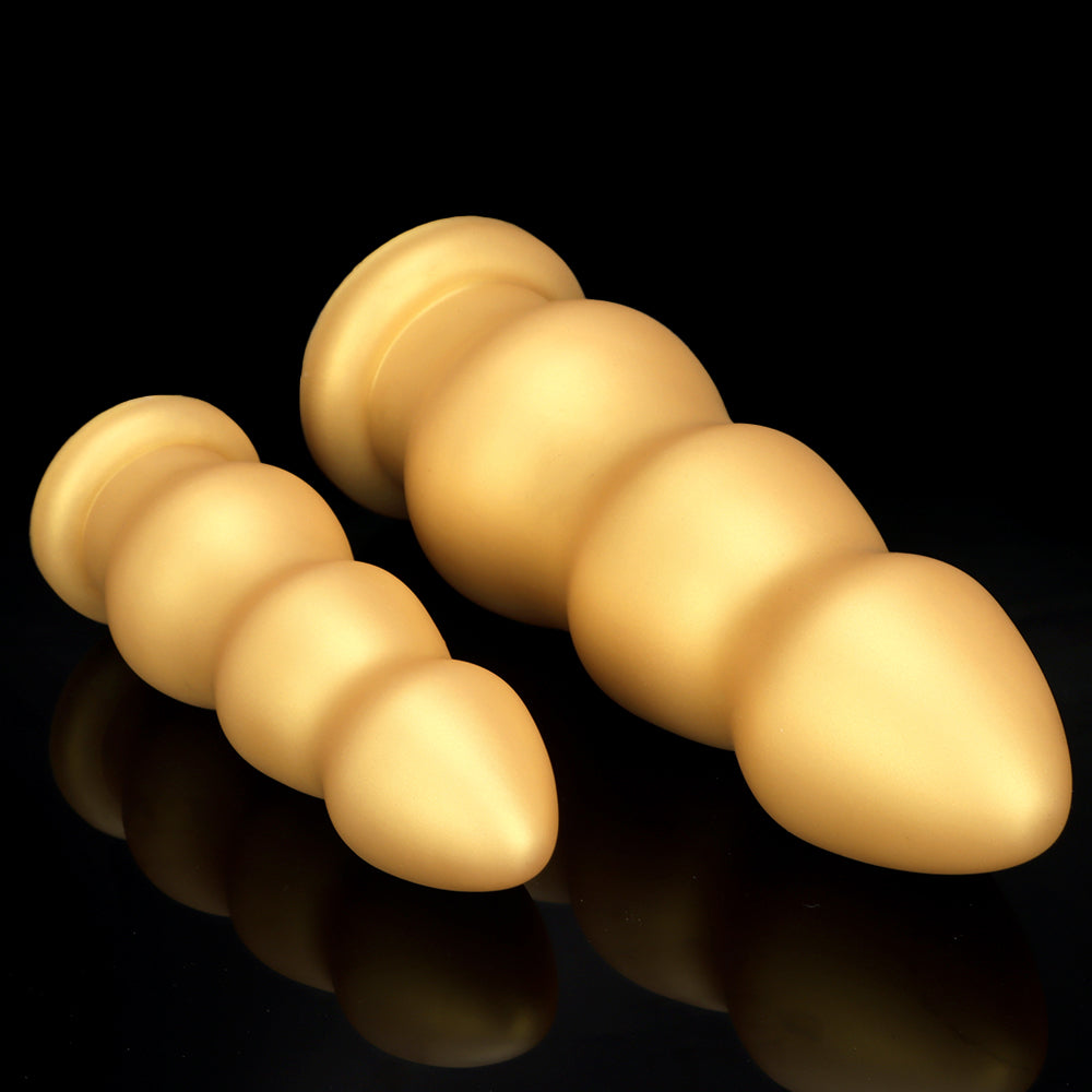 Thick silicone gold 3 inch diameter butt plug