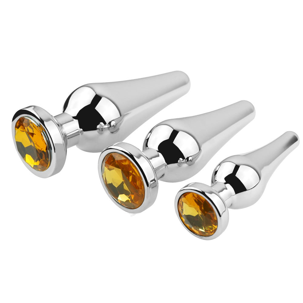Yellow tapered metal jeweled butt plugs